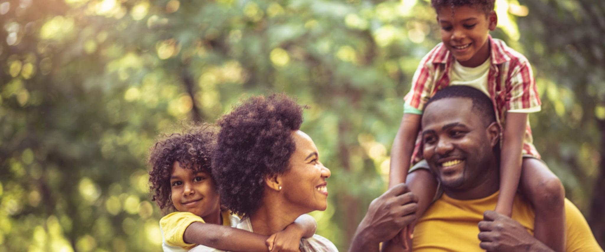 Happy African American Family Taking a Walk