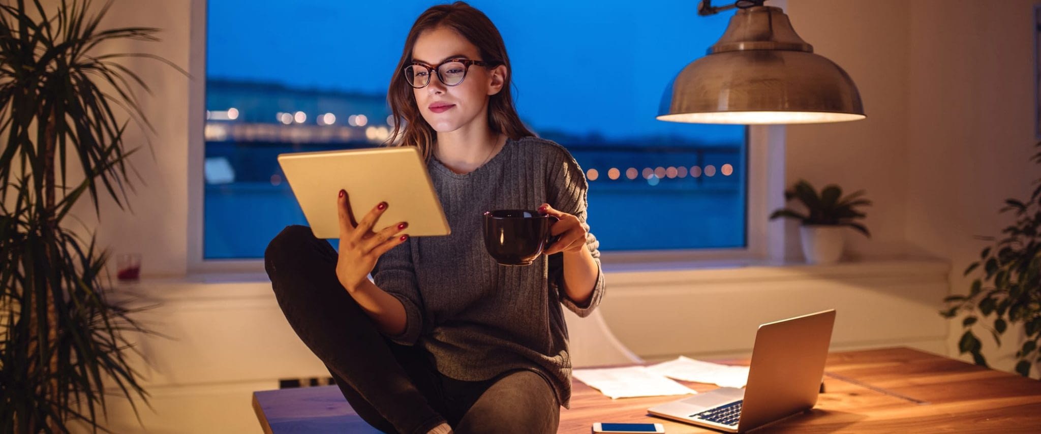 Young Woman Working at Home Late at Night