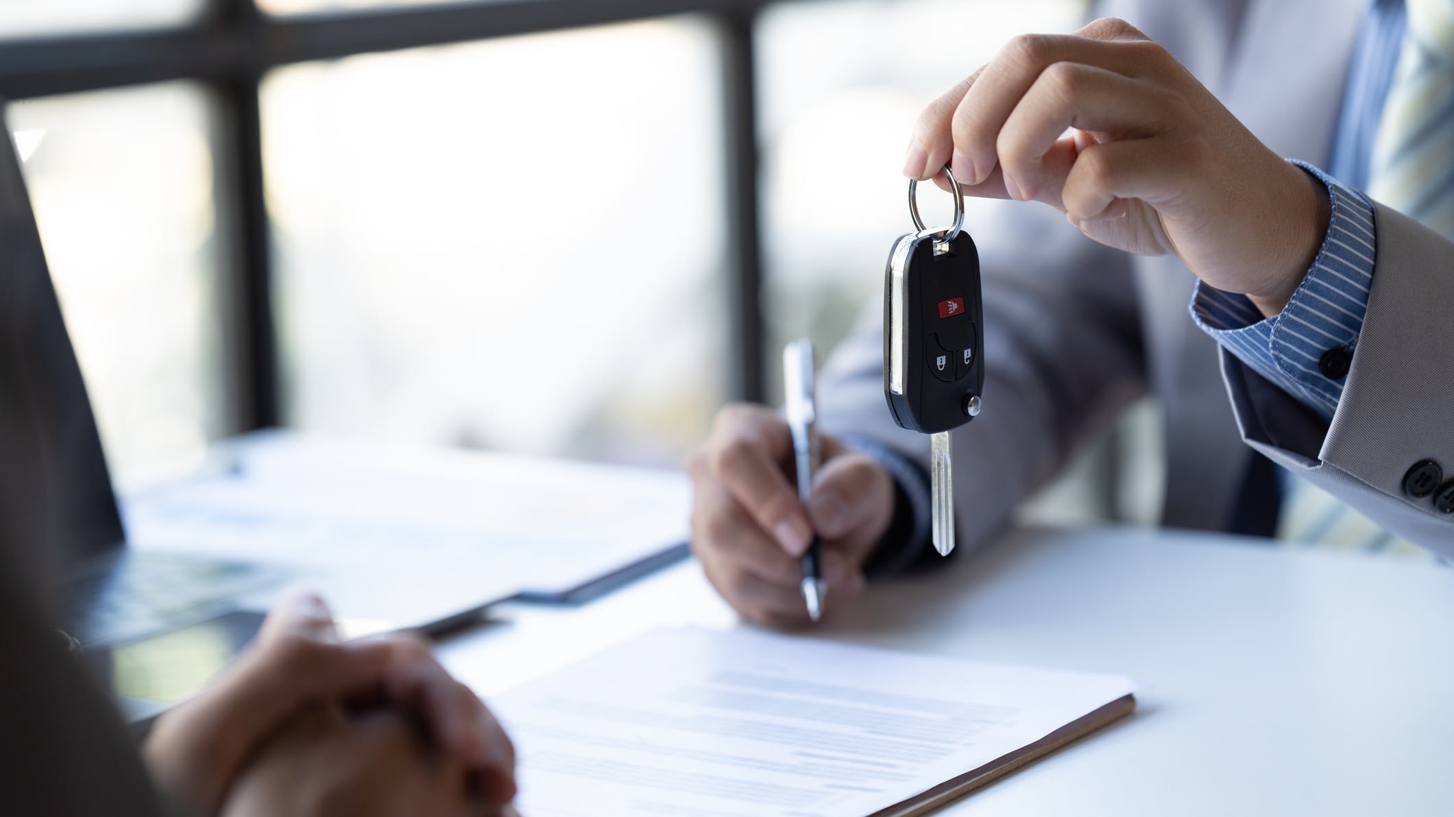 salesperson handing over keys