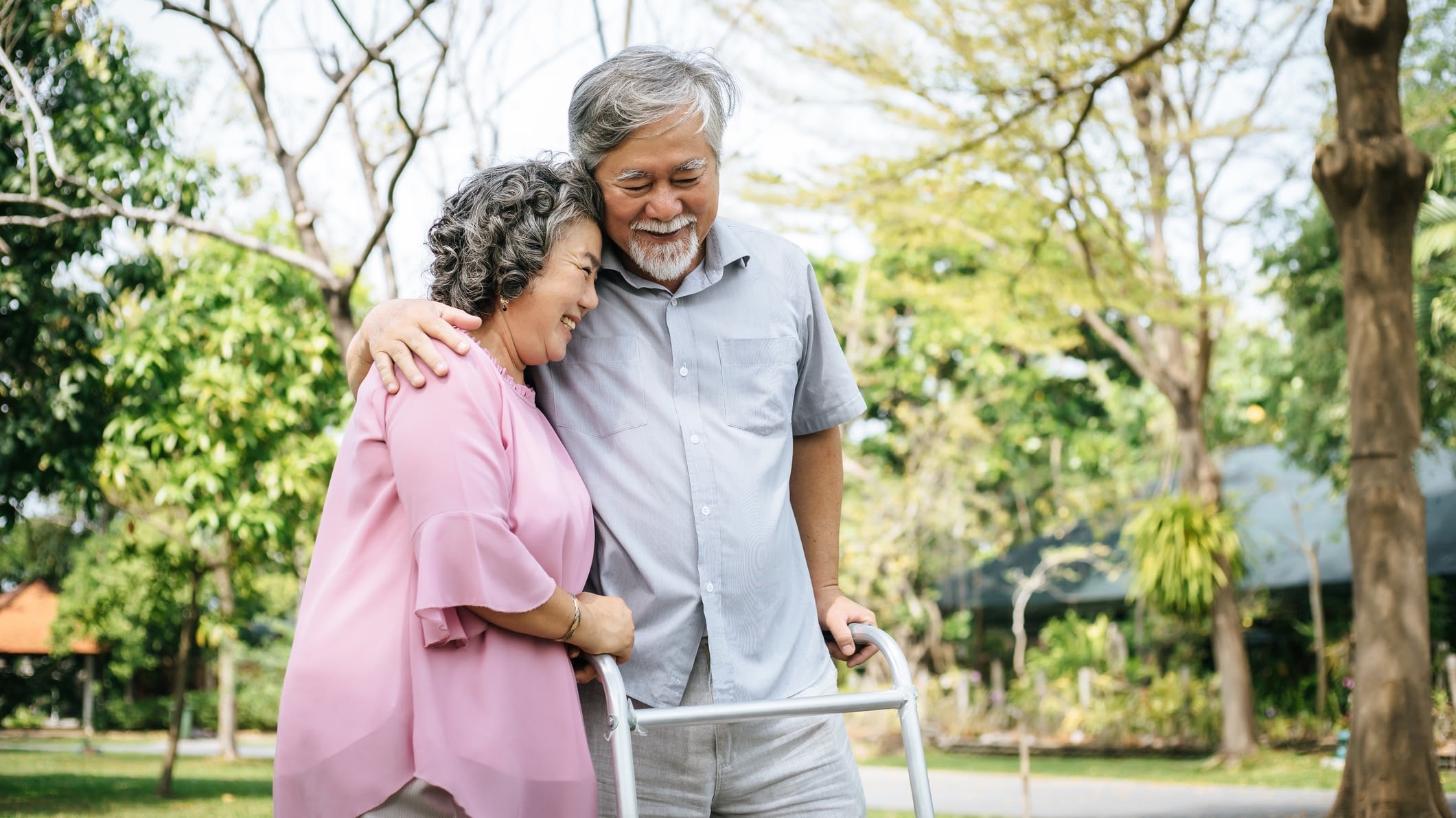 mature couple walking outside on waker