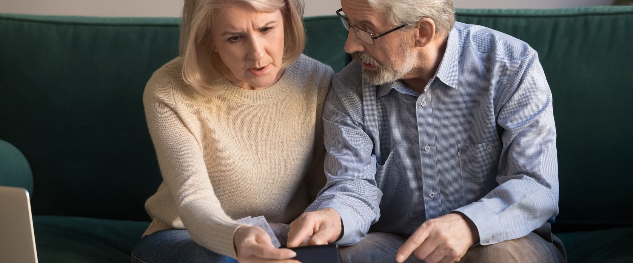 How to Avoid Medicare Penalties Confused Senior COuple Reviewing Paperwork