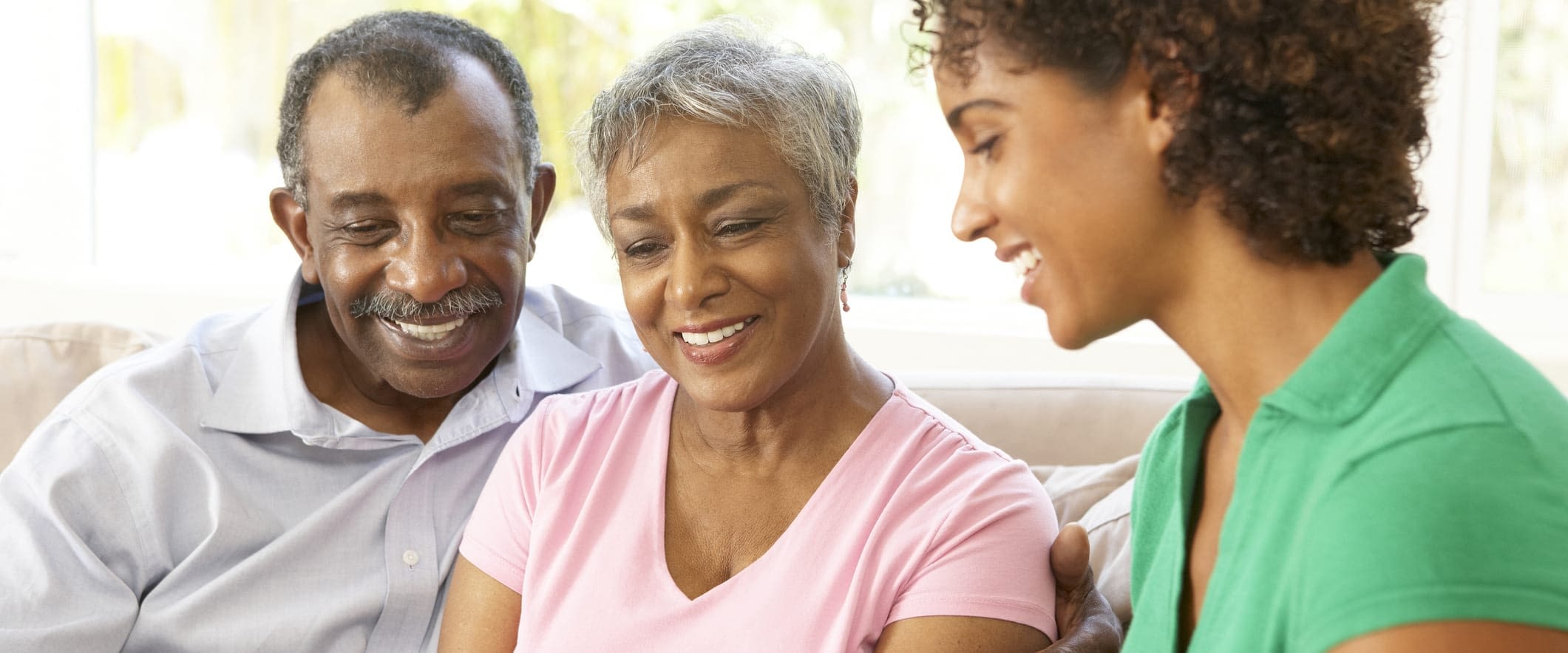 Social Security vs. Medicare Happy African American Couple With Advisor