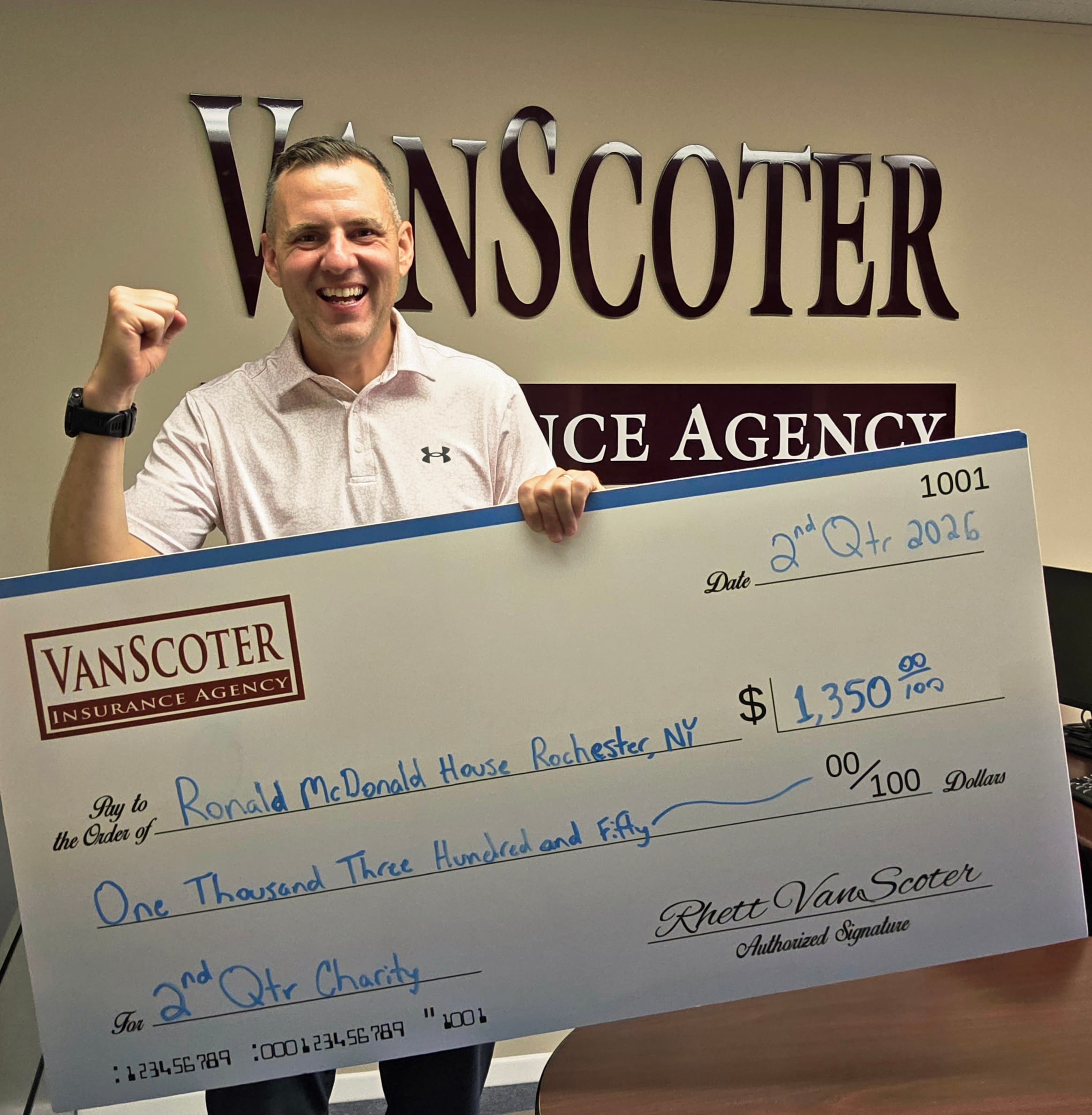 VanScoter Insurance Donation to Ronald McDonald House Charities of Rochester Rhett VanScoter holding an oversized donation check for $1,350 made out to Ronald McDonald House Charities of Rochester.