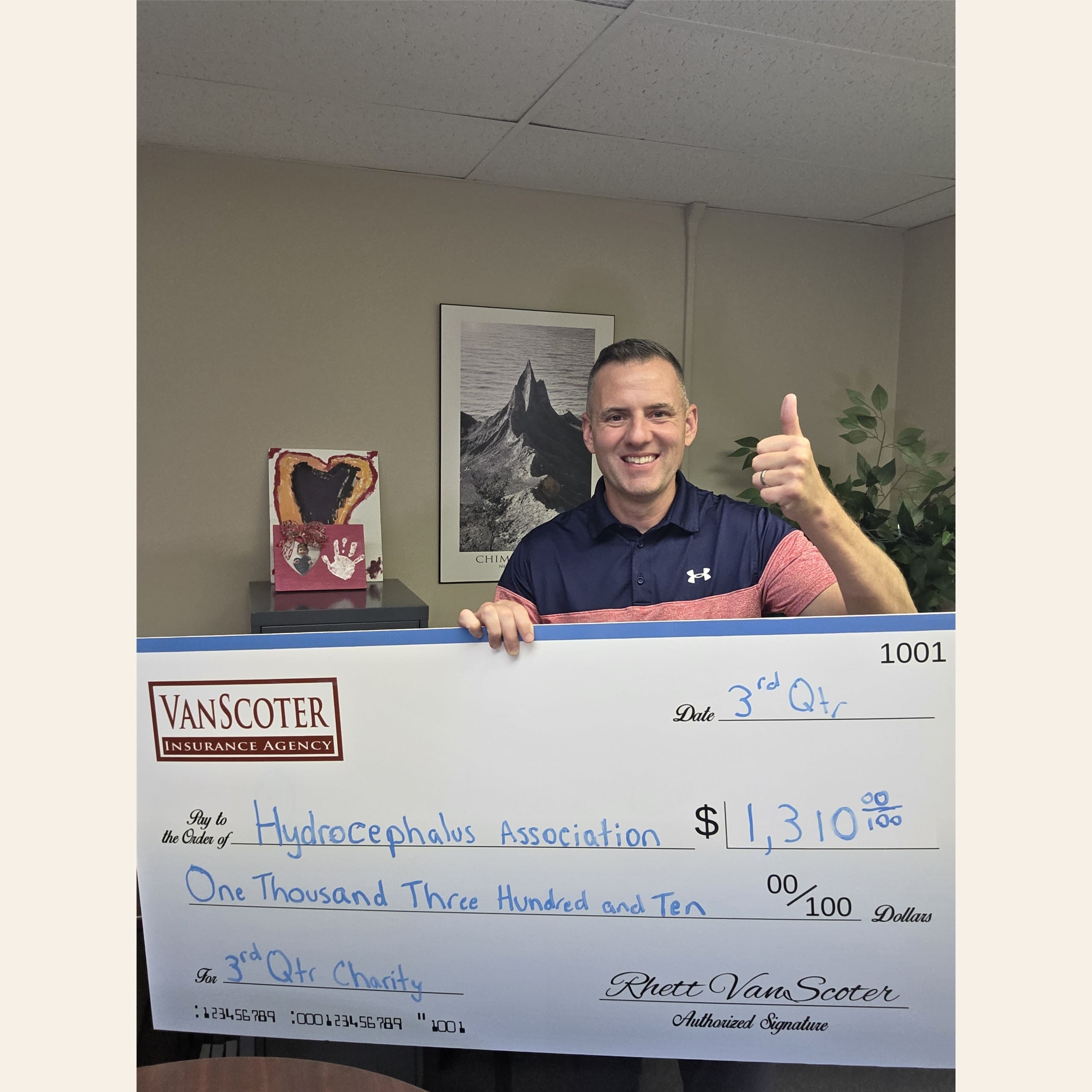 VanScoter Insurance Agency Q3 Donation to the Hydrocephalus Association Rhett VanScoter holding a $1,310 donation check for the Hydrocephalus Association