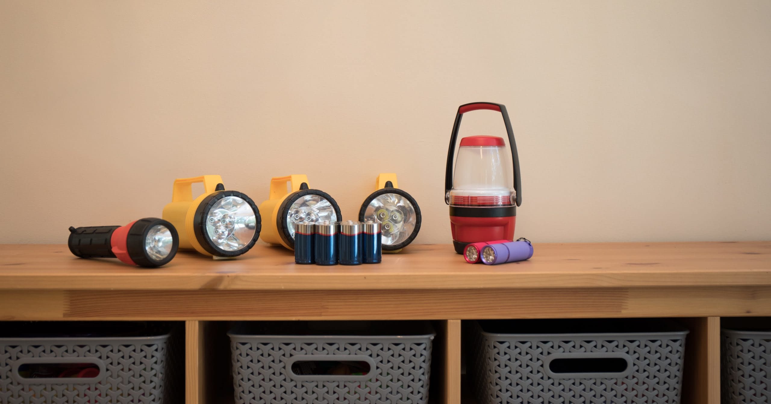 GettyImages-1309108720 flashlights and batteries on a table