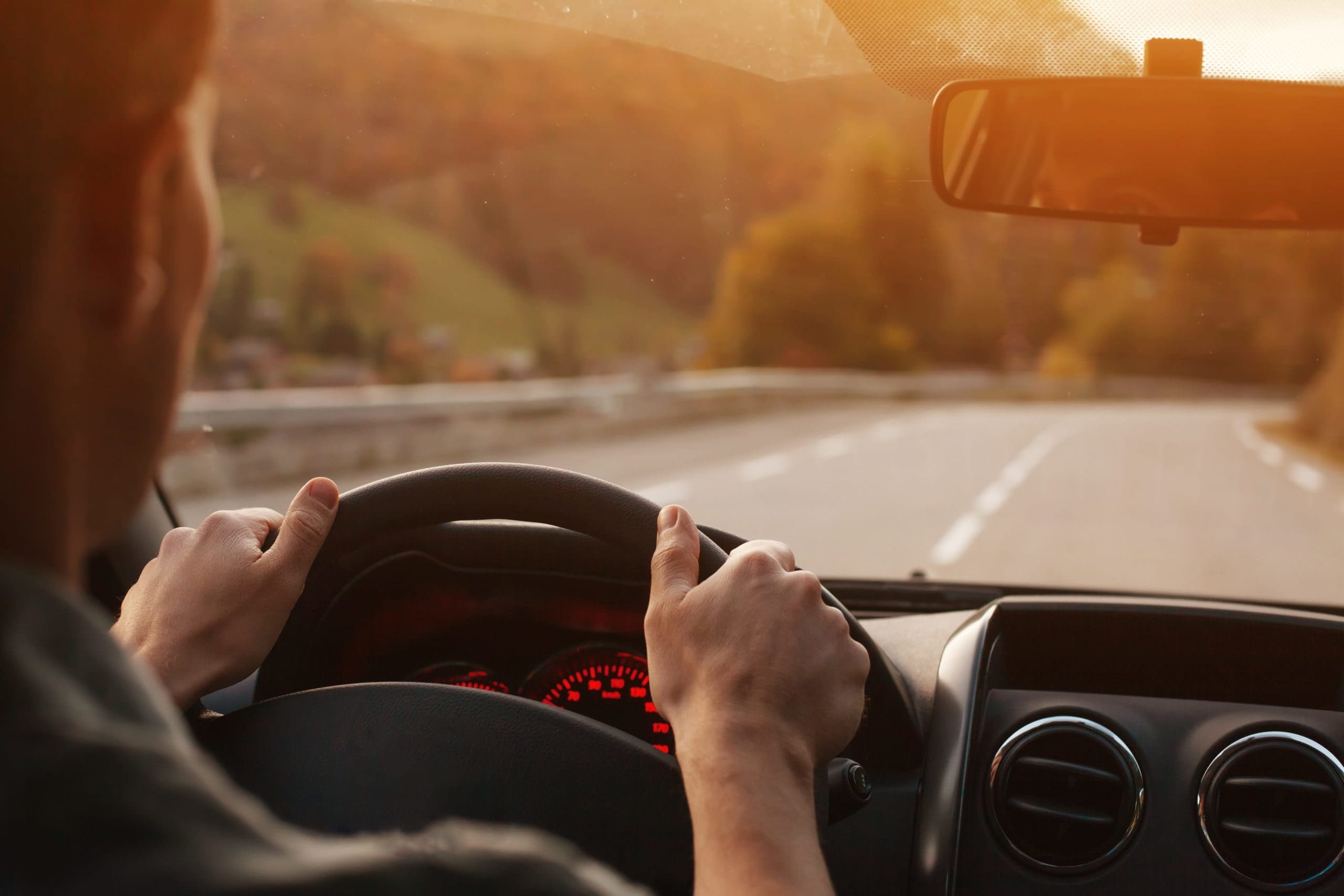 GettyImages-1214872234 man driving on highway