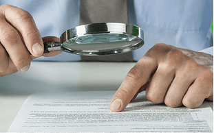 hands and magnifying glass