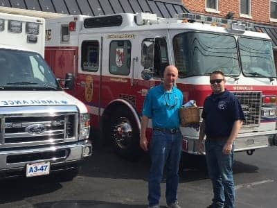 JP Wolfe founder with firefighter at local fire station