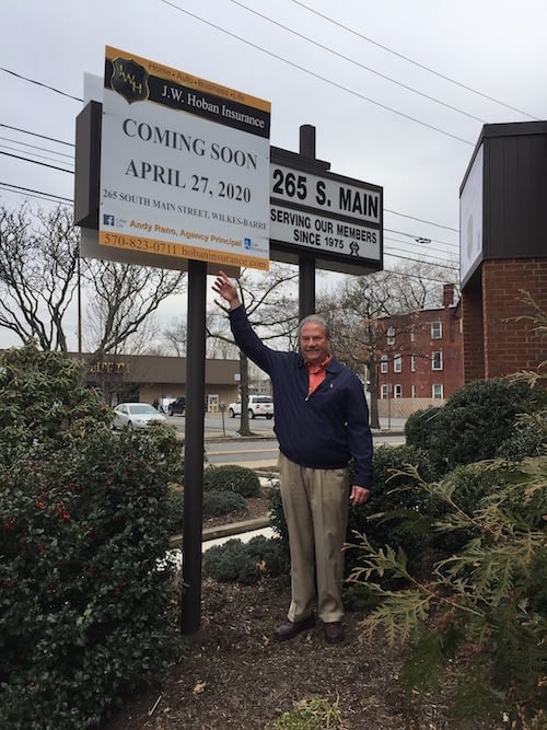 Andy in front of sign