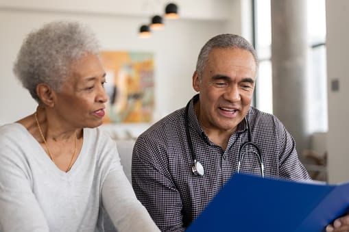 A doctor and an elderly patient