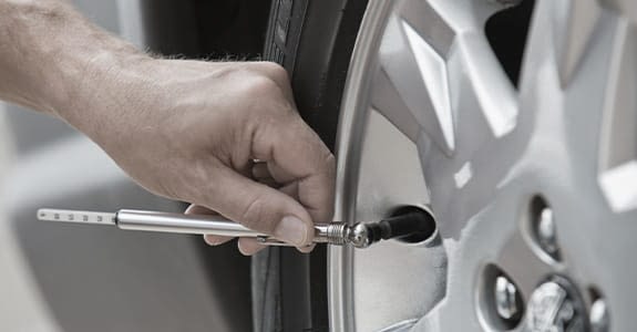 someone_checking_tire_pressure_575x300 Someone Checking Tire Pressure