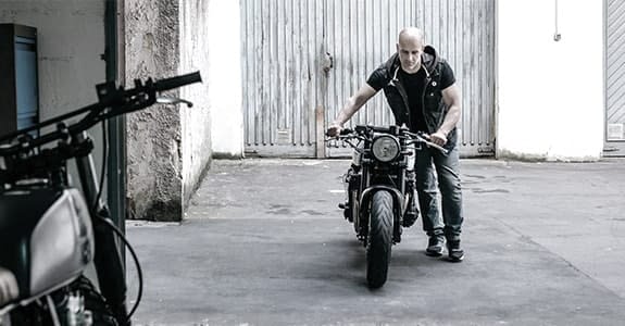 person_with_motorcycle_575x300