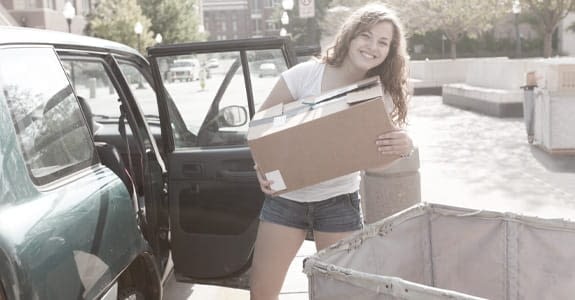 a_girl_standing_by_a_car_575x300