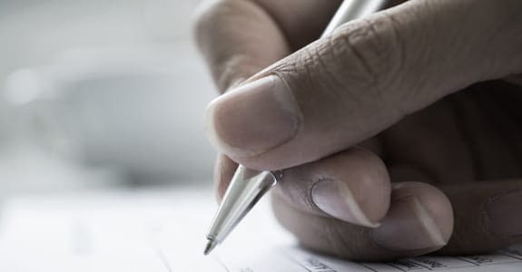 someone_writing_575x300 Someone Writing With Pen