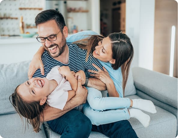family with daughter having fun at home