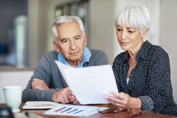 Medicare in Gulf Breeze, FL couple looking at papers