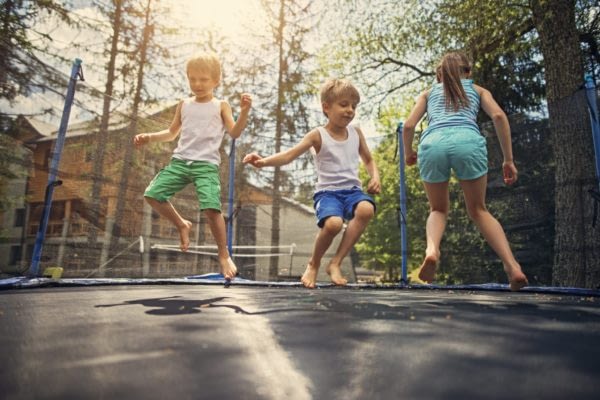 children jumping on trampoline in Oak Park River Forest