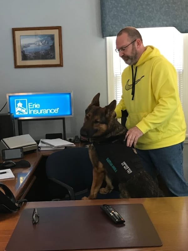 Our customer: A United States veteran and his service dog at the George A. Reed Agency