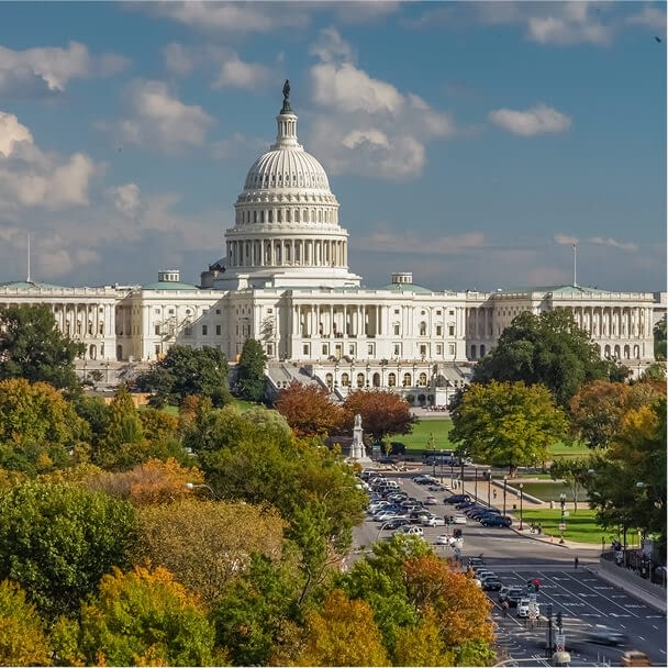 View down Pennsylvania Avenue toward the West Facade of the U.S. Capitol Building in Washington, DC. Autumn Season.