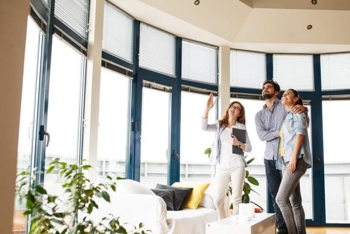 3 TA Coordinates Hotel and or Temporary Housing couple looking at a home with large windows