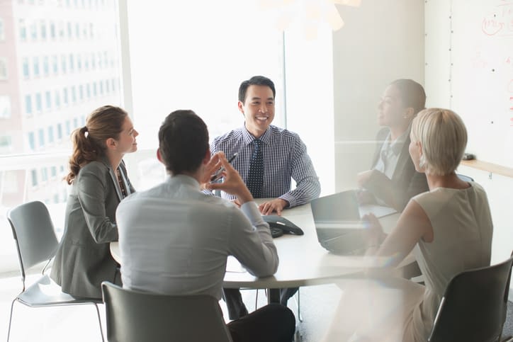 Business people talking in meeting Business Colleagues Having a Meeting In a Boardroom