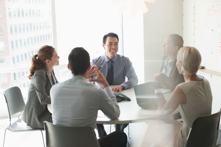 Business Colleagues Having a Meeting In a Boardroom