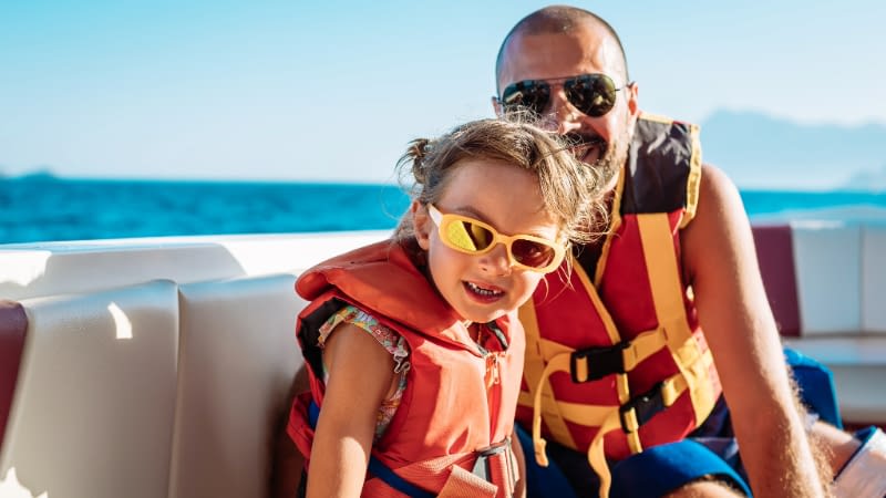 Boat Insurance 71526 Dad and daughter smiling in a boat