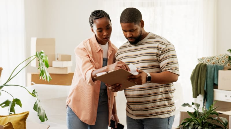 Home Insurance 92226 Young couple reviewing home inventory list
