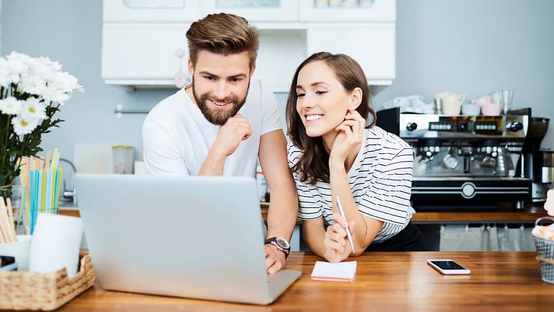 Young couple running a small coffee shop
