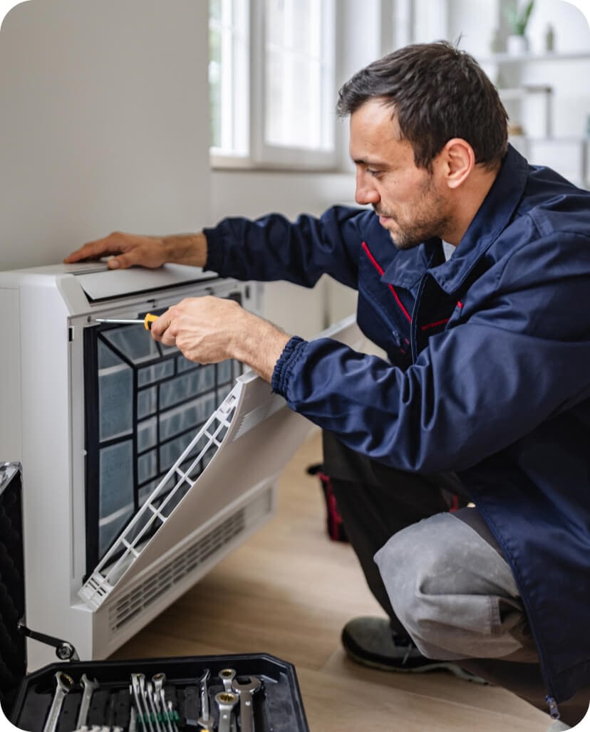 handyman-repairing-air-conditioning-unit