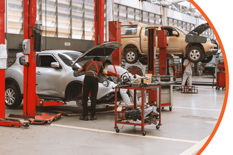 people working in a garage