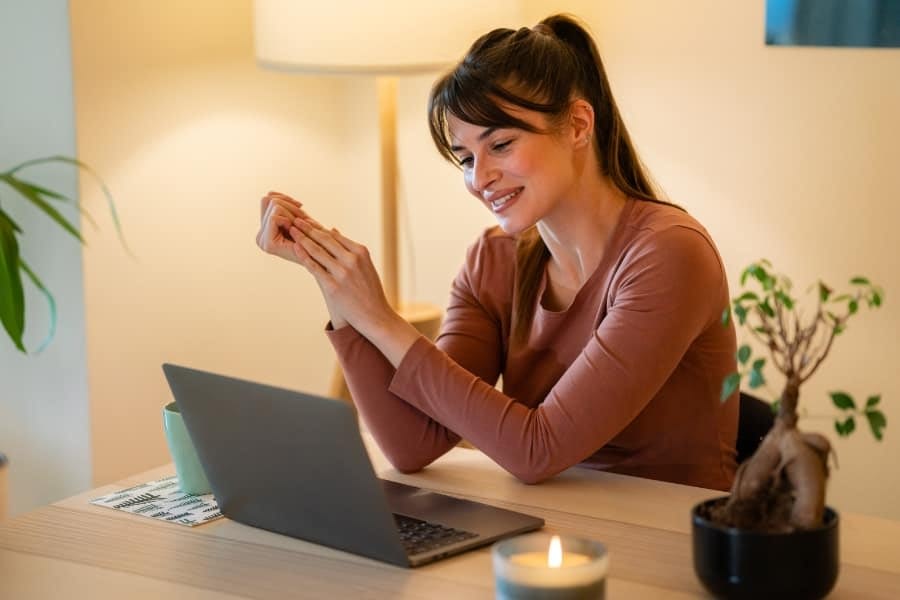 Woman at home on laptop