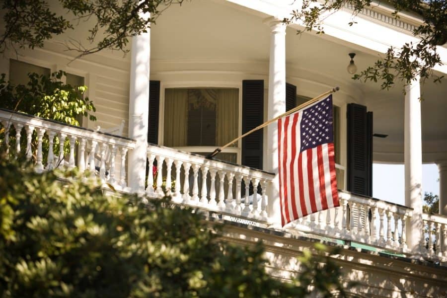 home with American flag on the porch