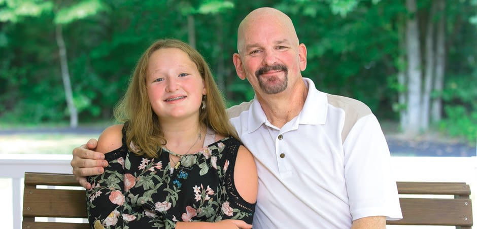 father and daughter on bench