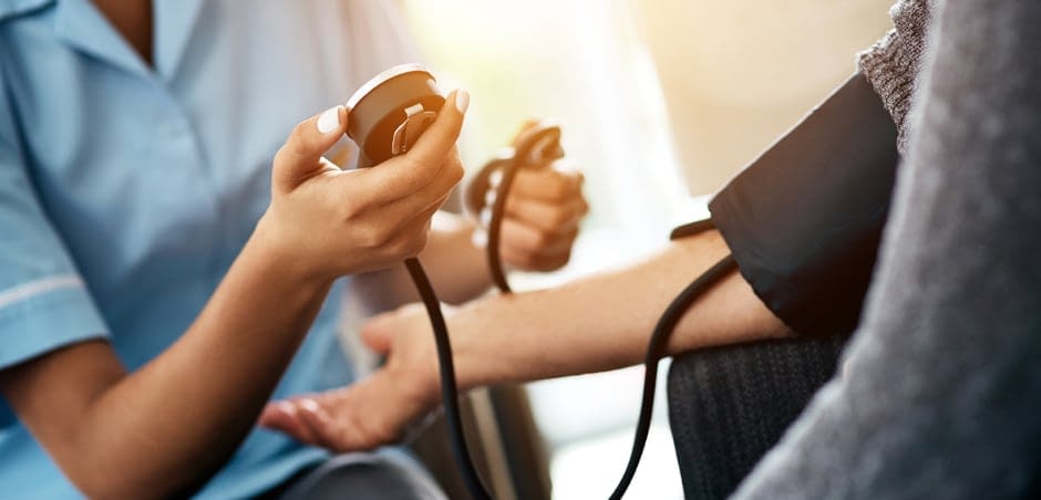 paramed-large nurse giving patient a blood pressure test