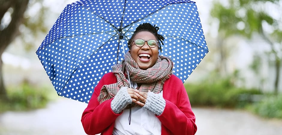 2021_eriesenseblog-umberllacoverage-large-1 woman holding an umbrella