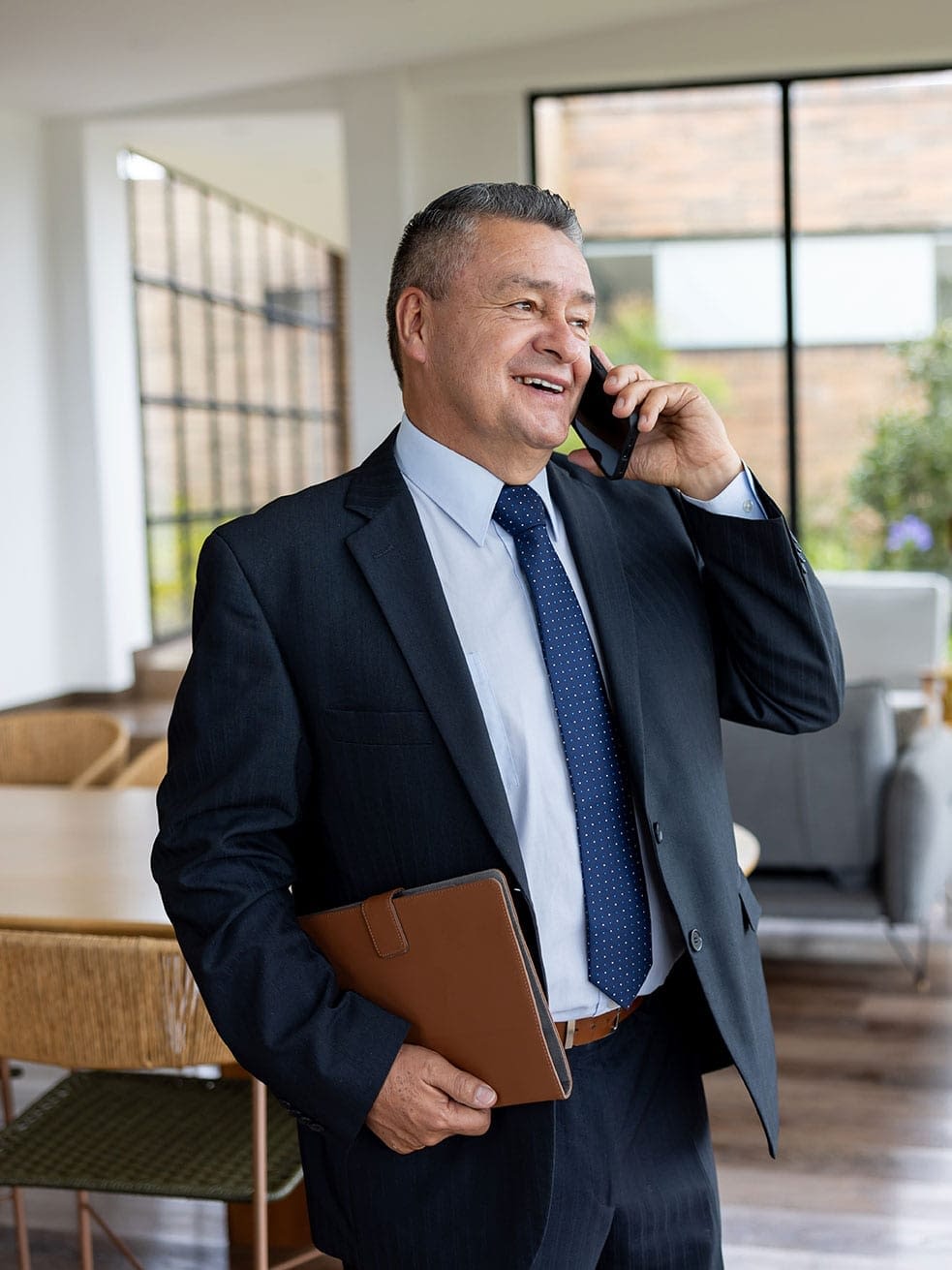 real-estate-agent-on-phone-in-house