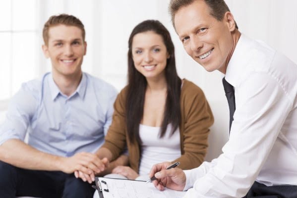 insurance-agent-with-young-couple