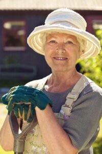 Senior woman gardening outside