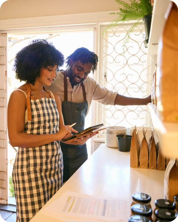 Couple working in their business