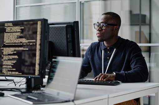 a man working in front of a computer