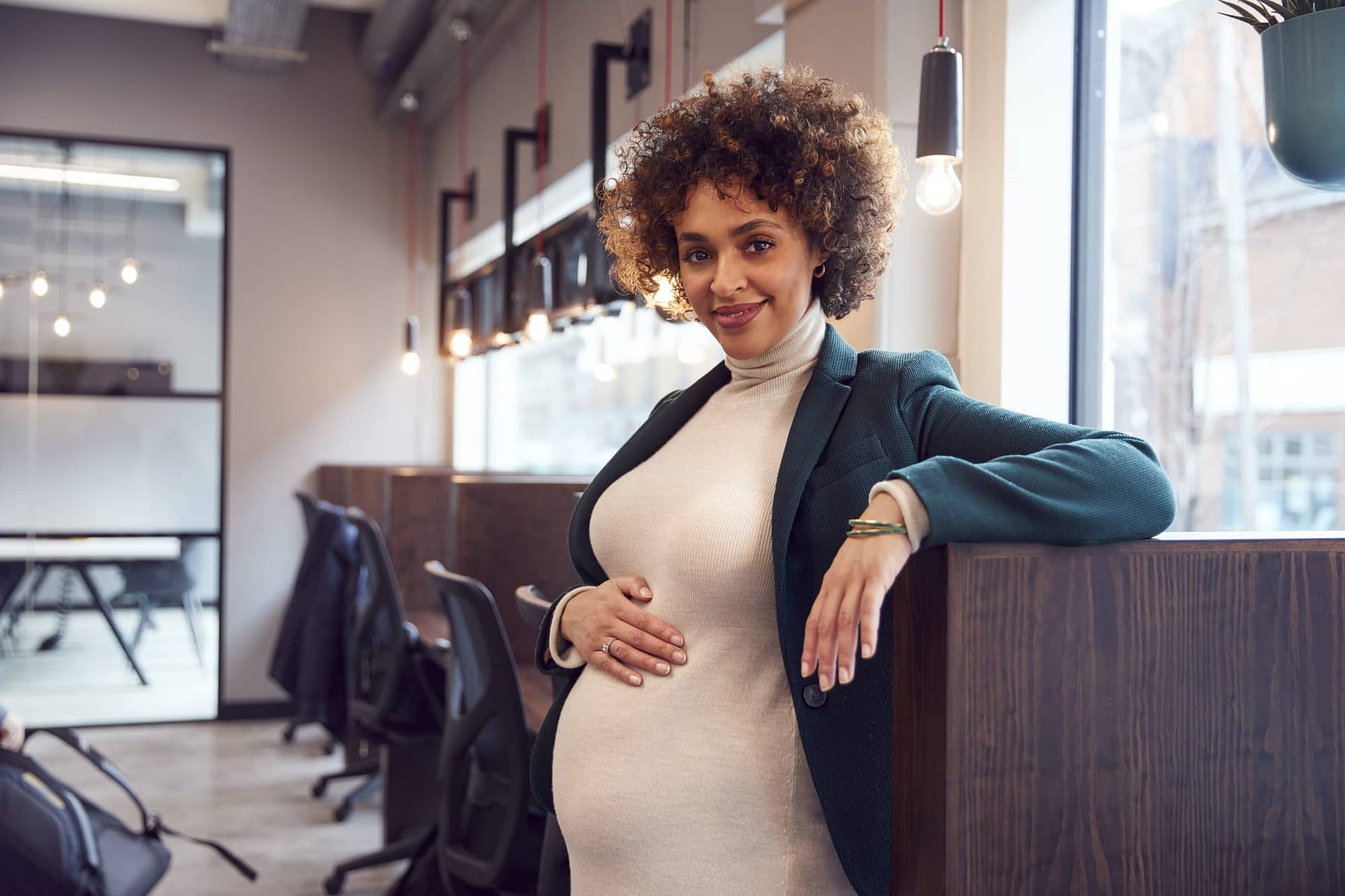 Pregnant Businesswoman Holding Bump