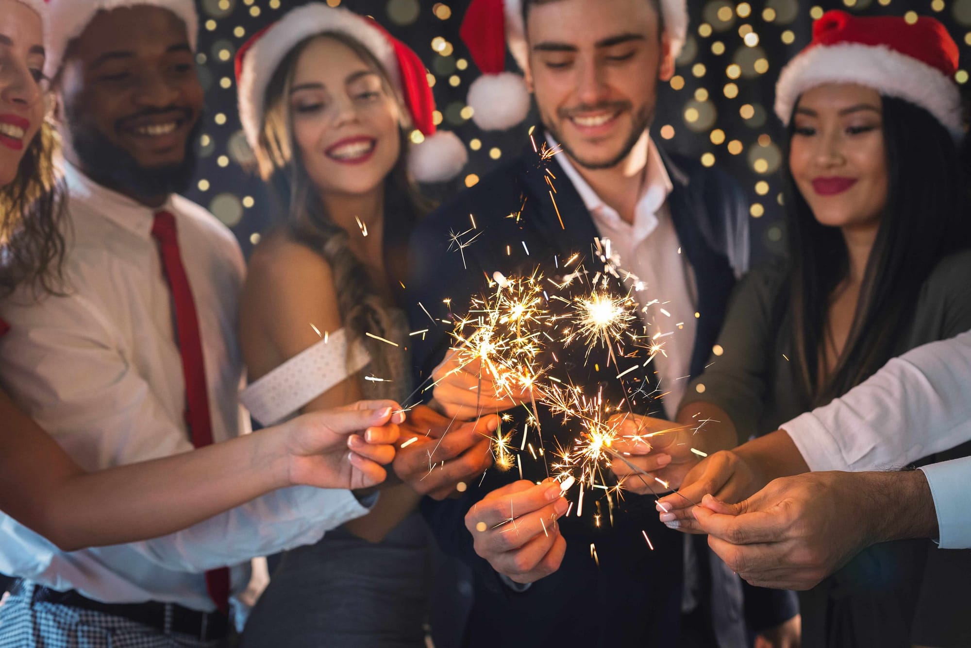 group of people lighting sparklers